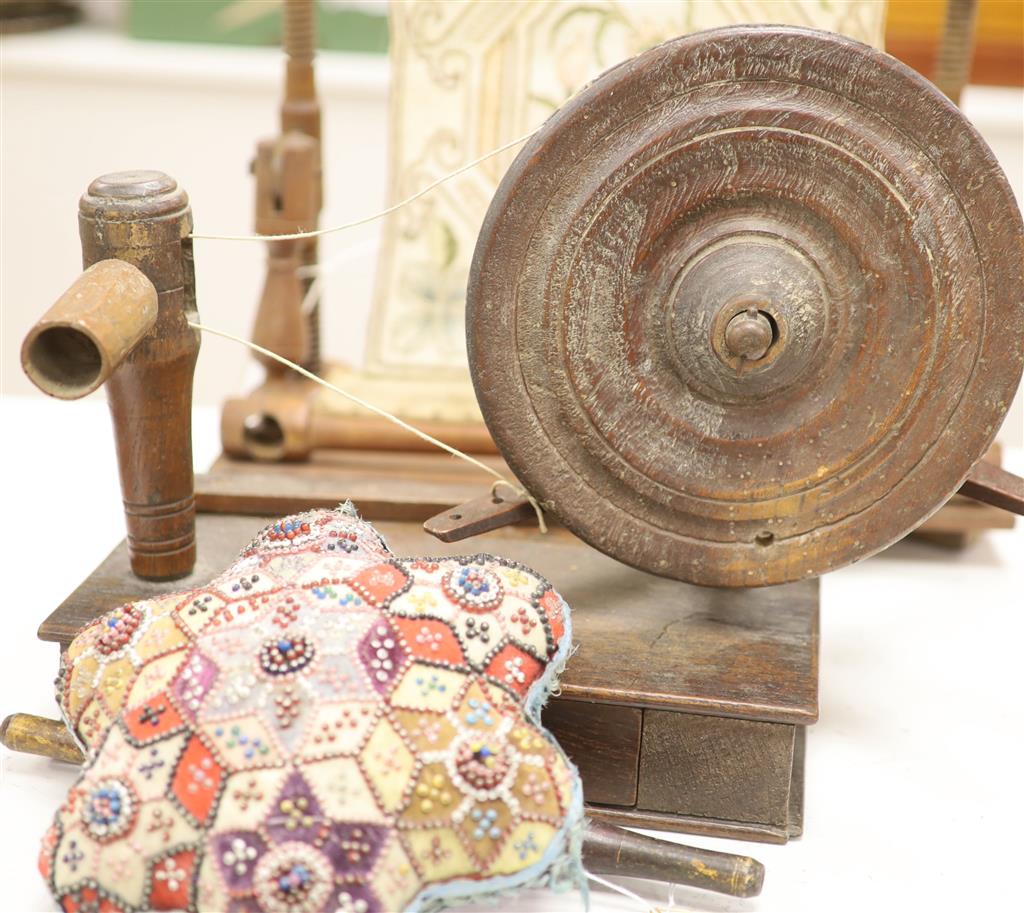 A Victorian bead and patchwork star-shaped pin cushion by M E Ashmore 1884 and two other items, W 20cm (cushion)